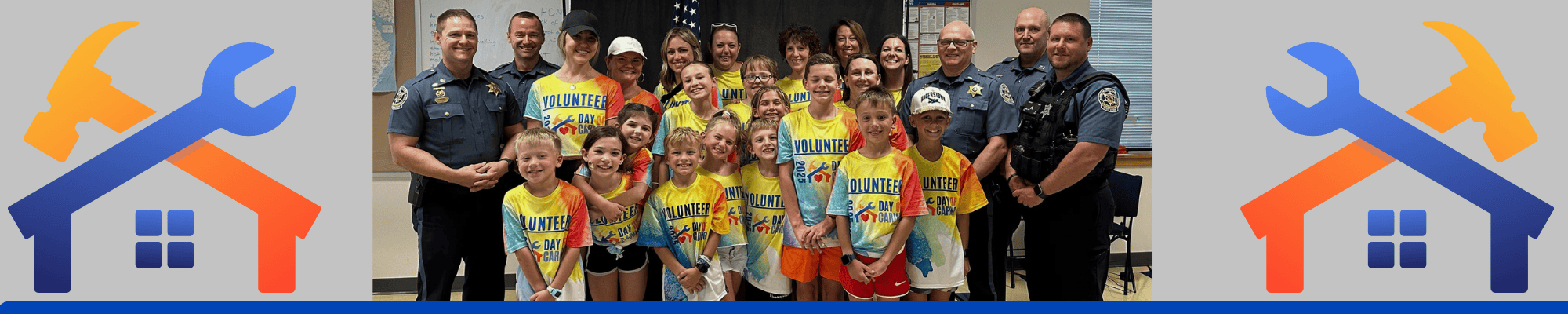 Group of children and parents with the local sheriff's deputies