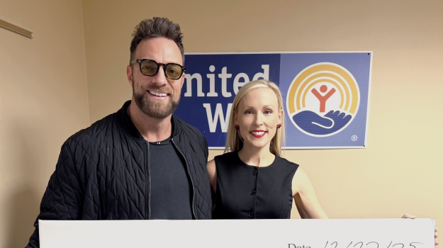 LA Knight presenting check to United Way