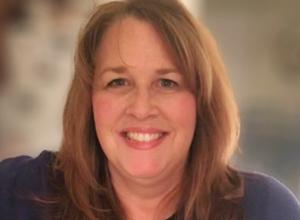 Woman with blonde hair smiling