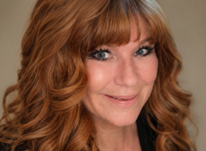 Woman with red hair smiling